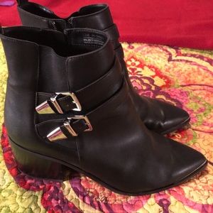 Black leather booties with silver details